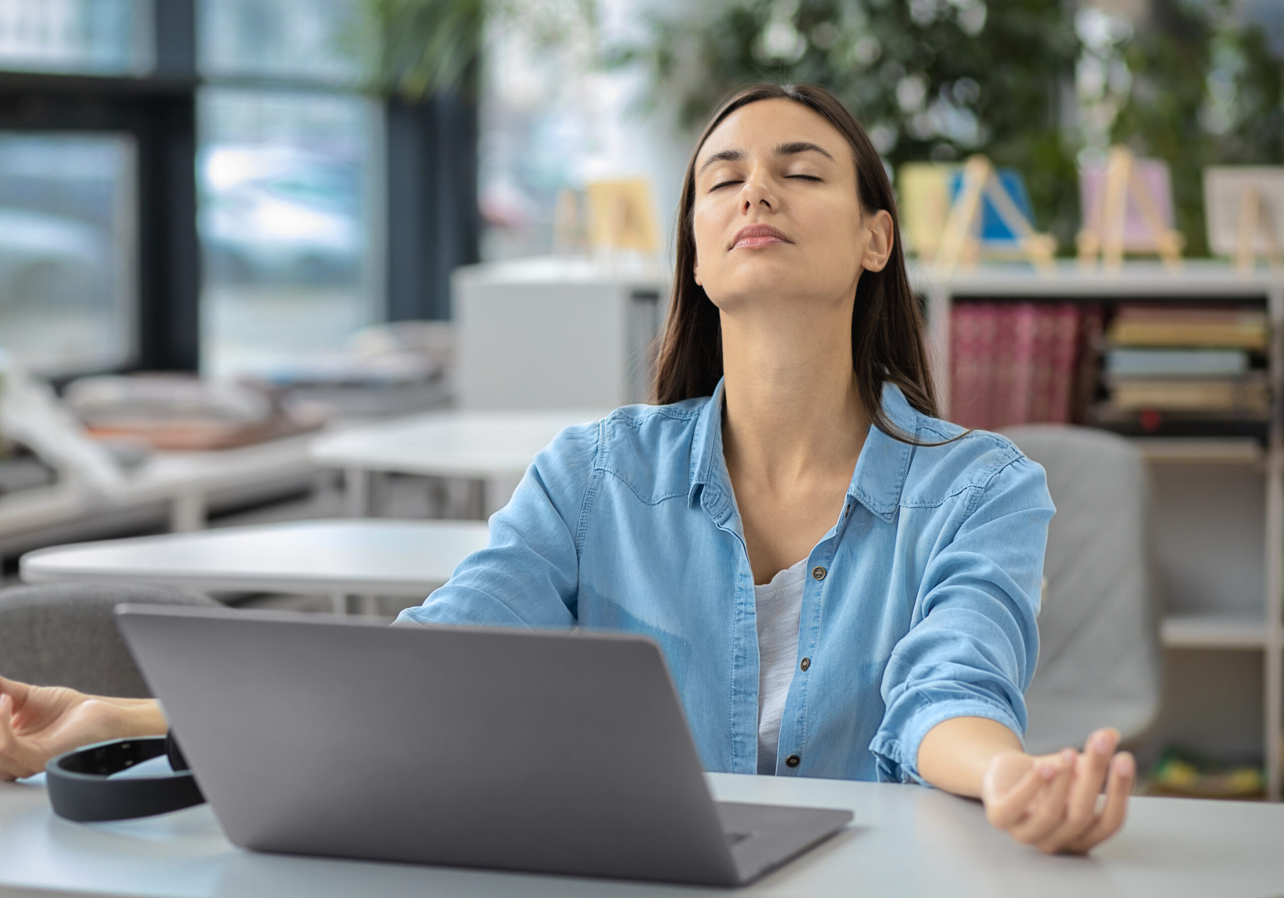 Handsome successful businessman meditate while sitting at home office